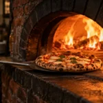 Forno a lenha: 450 graus e 90 segundos por pizza
